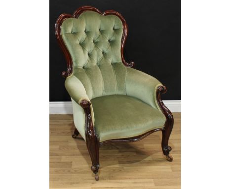 A Victorian mahogany drawing room armchair, 'trefid' back, acanthus scroll arms, deep button stuffed over upholstery, cabriol