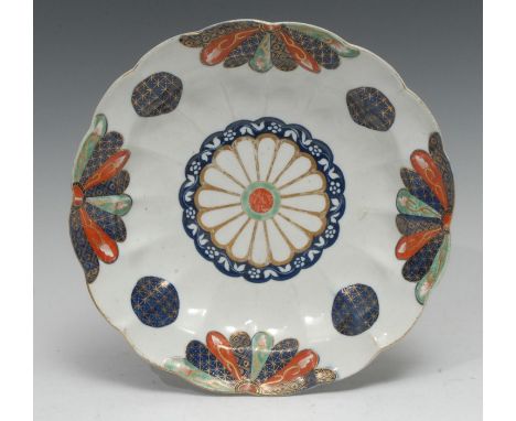 A Worcester Old Japan Fan pattern shaped circular dish, painted in the Imari palette, picked out in gilt with diapers, flower
