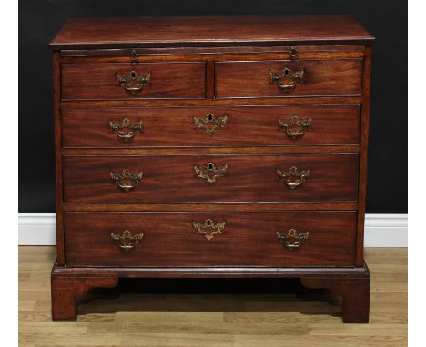 A George III mahogany bachelor's chest, moulded top above a slide and two short and three long graduated cockbeaded drawers, 
