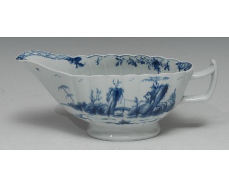 A large Worcester Fringed Tree pattern fluted sauceboat, painted in underglaze blue in the Chinoiserie taste, tau-shaped hand