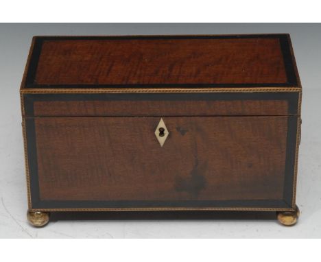 A George III mahogany rectangular tea caddy, the hinged cover enclosing a mixing bowl flanked by a pair of lidded compartment