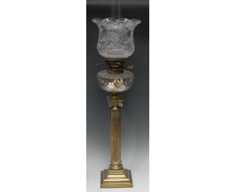 A Hink's Patent oil lamp, clear cut glass font supported by brass ionic column and stepped base, acid etched clear glass shad