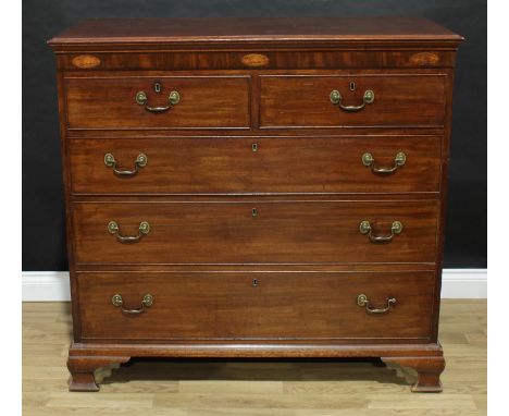 A George III mahogany chest, moulded rectangular top above a deep frieze inlaid with three oval shell paterae, above two shor