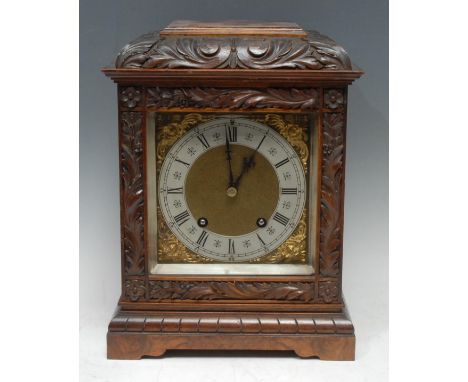 An early 20th century walnut bracket clock, 15cm square brass dial with silvered chapter ring inscribed with Roman and subsid