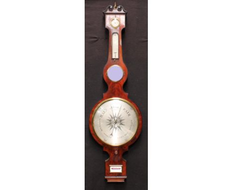 A Victorian flame mahogany wheel barometer, swan neck pediment centred by a brass urnular finial, above a protimeter, thermom