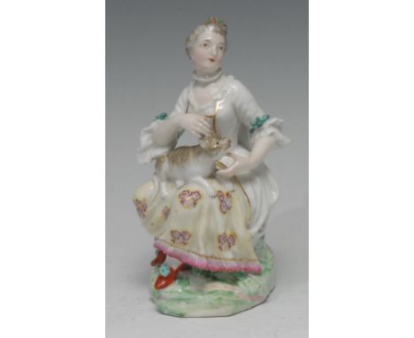 A Derby Patch Mark figure, of a lady seated with dog, 14cm high, c.1770 