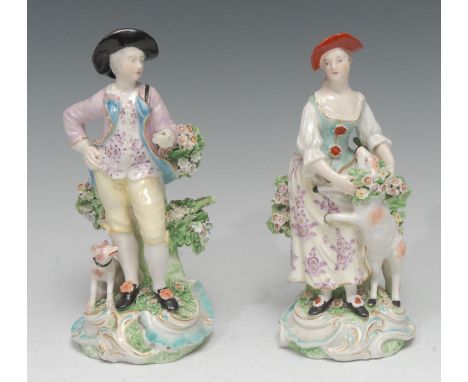 A pair of Derby Patch Mark figures, The Garland Shepherds, he wearing a broad brimmed black hat, pink jacket, yellow breeches