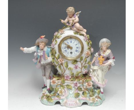 A Sitzendorf porcelain mantel clock, 8.5cm enamel dial inscribed with Arabic numerals, single winding hole, eight-day movemen