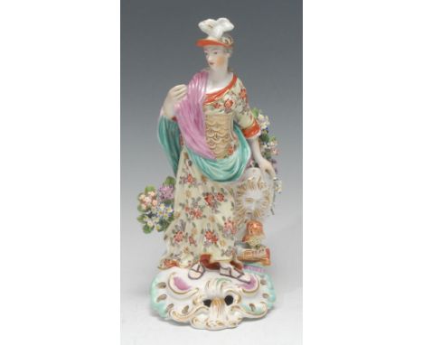 A Derby Patch Mark figure, Minerva, The Goddess of Wisdom, she stands wearing a feathered helmet, coat of mail and floral boc