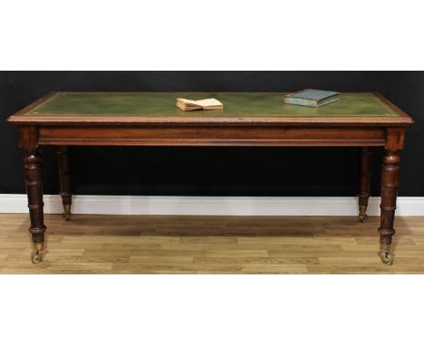 A Victorian oak library writing table, rounded rectangular moulded top with inset tooled and gilt leather writing surface, ab