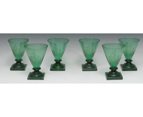 A set of six Art Deco green glass drinking glasses, each conical-shaped bowl engraved with a galleon, square pedestals, 'lemo