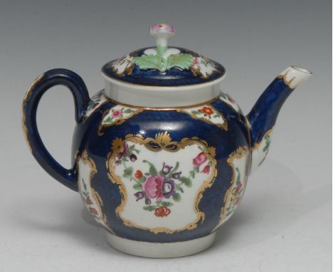 A Worcester globular teapot and cover, painted in polychrome with English flowers on a scale blue ground, gilt foliate C-scro