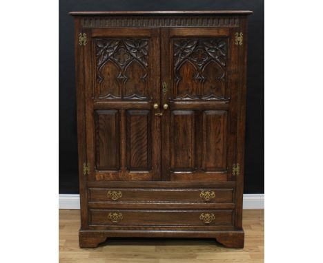 Frank Pratt of Derby - a 17th century style oak press cupboard or hall robe, rectangular top with moulded edge above a nulled