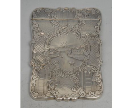 An early Victorian silver shaped rectangular castle top visiting card case, engraved with a landscape vignette, on an engine 