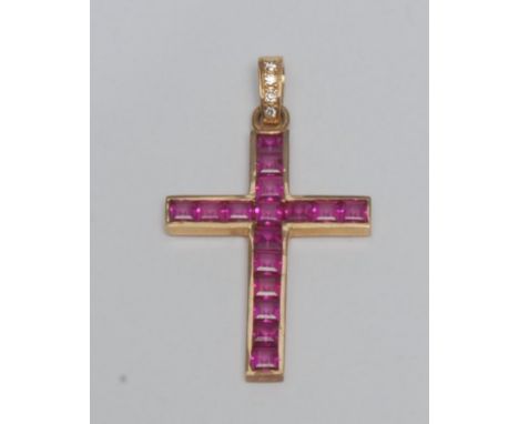 A ruby and diamond cross pendant, channel set with sixteen square baguette cut pinky red rubies, (possibly synthetic) beneath