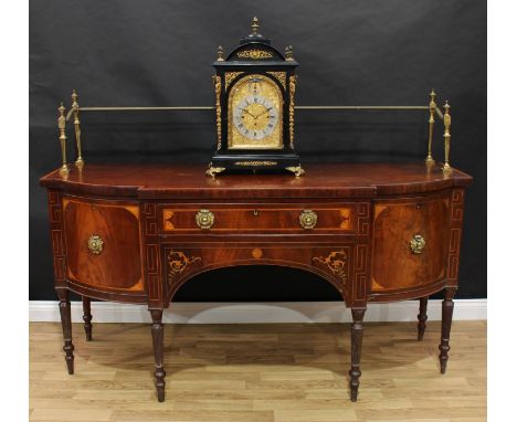 A Regency mahogany and marquetry sideboard, slightly oversailing crossbanded top with tall brass gallery above a central frie