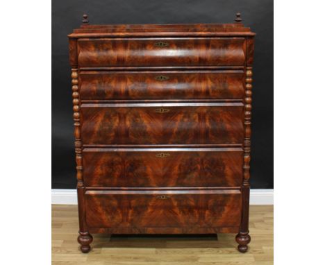 A 19th century Biedermeier flame mahogany chest, caddy top with turned finials above five long drawers, flanked by inset turn