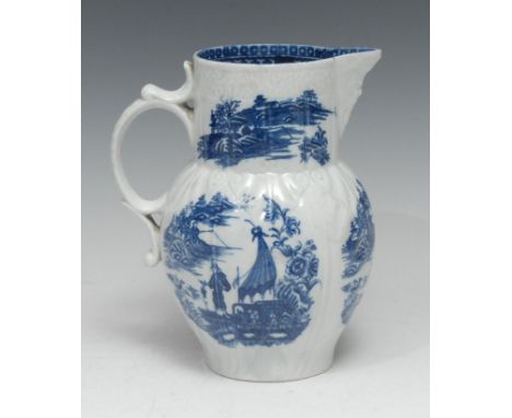 A Caughley Pleasure Boat pattern mask jug, printed in underglaze blue with Chinoiserie landscape vignettes, the baluster moul