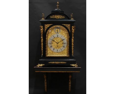 A substantial Victorian gilt metal mounted ebonised musical bracket clock, in the George II taste, 19cm arched brass dial, si