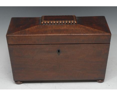 A George IV mahogany sarcophagus tea caddy, hinged cover enclosing a bowl flanked by a pair of compartments, inlaid ebony esc