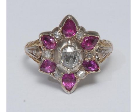 A 19th century ruby and diamond cluster ring, central oval rose cut diamond collar set, surrounded by a six point star collar