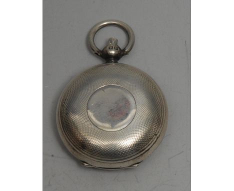 A George V silver circular sovereign case, engine turned, 5cm over loop, Birmingham 1911 