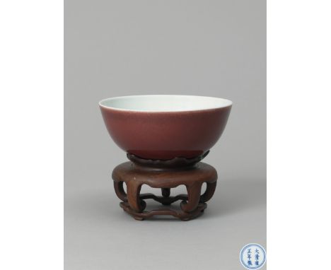 Well potted with slightly flared sides resting on a countersunk foot, the exterior applied with a rich red glaze, the interio