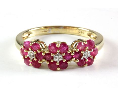 A 9ct yellow gold ruby and diamond triple cluster ring (M).