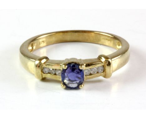 A 9ct yellow gold untreated Ceylon sapphire and diamond set ring, (L.5).