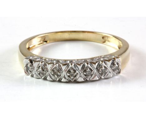 A 9ct yellow gold diamond set half eternity ring, (Q).