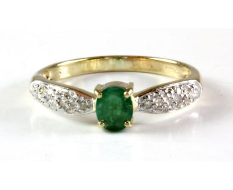 A 9ct yellow gold emerald and diamond set ring, (L.5).