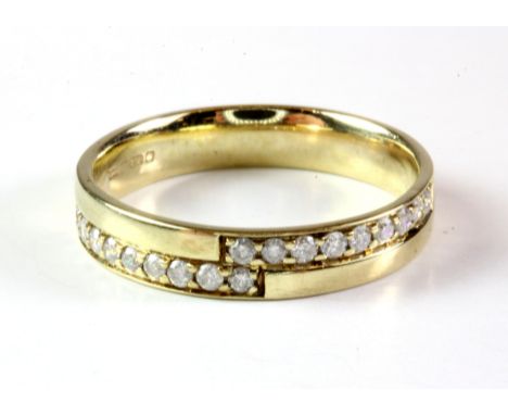 A 9ct yellow gold diamond set half eternity ring, (K.5).