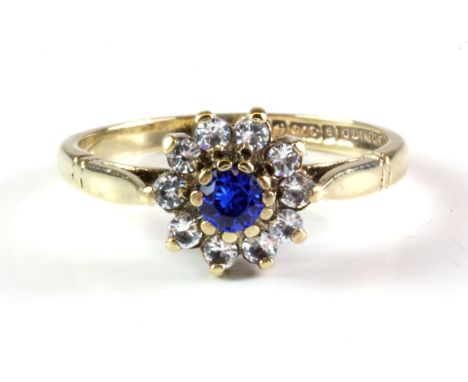 A 9ct yellow gold cluster ring set with blue and white spinels, (N).