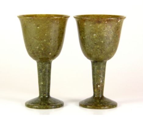 A pair of Chinese carved jade/ hardstone stem cups, H. 9cm.
