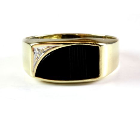 A gentleman's 9ct yellow gold onyx and diamond set ring, (T.5).