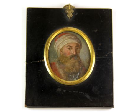 A Georgian framed miniature oil portrait of a Moorish merchant, 10 x 12cm.