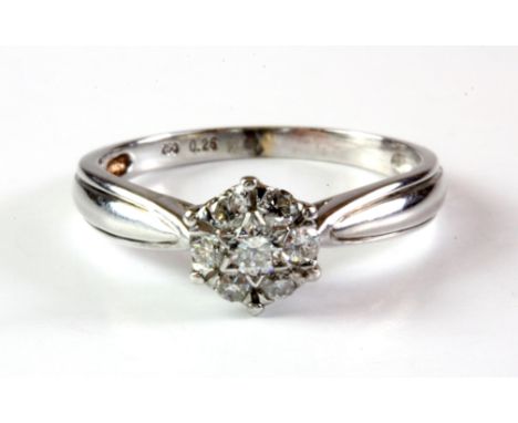 An 18ct white gold diamond set cluster ring, (M.5).