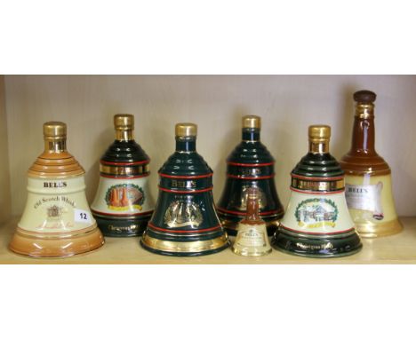 Seven bottles of un-opened Bells Scotch whiskey.