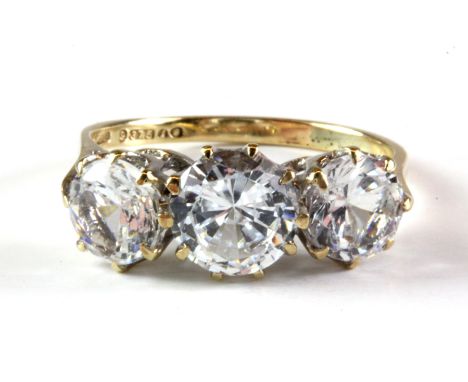 A 9ct yellow gold ring set with three brilliant cut spinels.