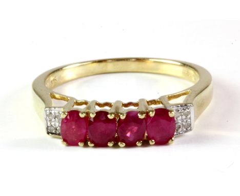 A 9ct yellow gold ruby and diamond set ring, (O).