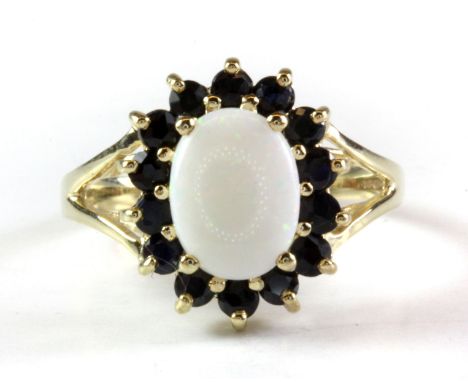 A 9ct yellow gold opal and sapphire set cluster ring, (H).