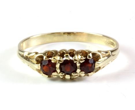 A 9ct yellow gold garnet set ring, (P.5).