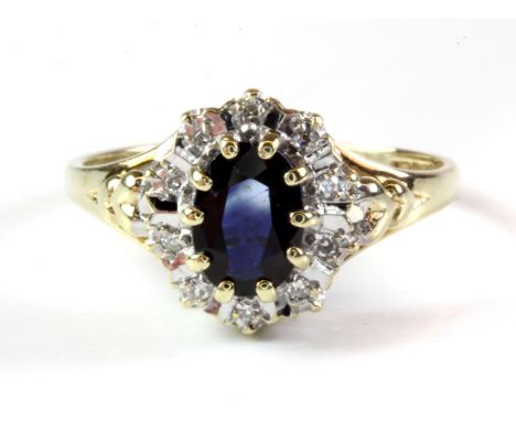 A 9ct yellow gold sapphire and diamond set cluster ring, (M).