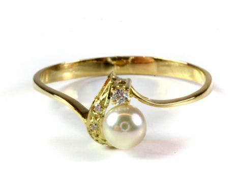 An 18ct yellow gold (stamped 750) pearl and diamond set ring, (U).