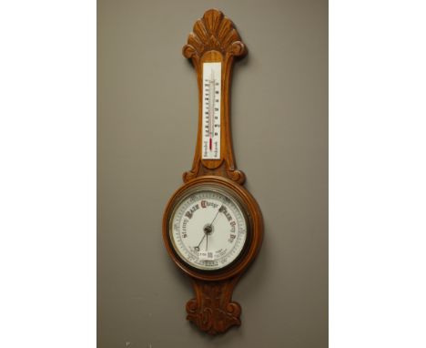 Edwardian oak Aneroid barometer with thermometer, circular dial with leaf carved detail, H82cm   Condition Report   Click her