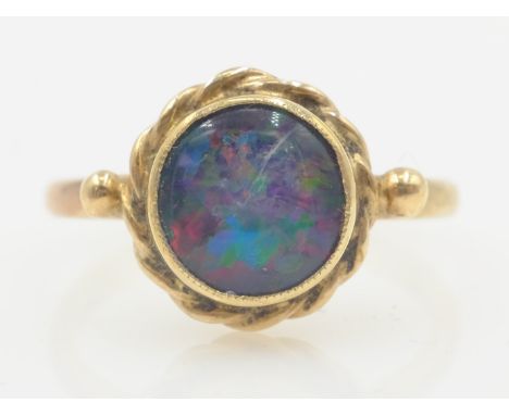 9ct gold black opal ring rim and rope setting (tested)   Condition Report  3.2GMSIZE Q Click here for further images, conditi