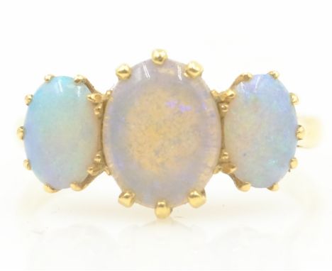 Three stone opal gold ring stamped 18ct   Condition Report  3.3GMSIZE Q Click here for further images, condition, auction tim