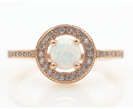 Rose gold on silver opal halo dress ring stamped 925   Condition Report   Click here for further images, condition, auction t