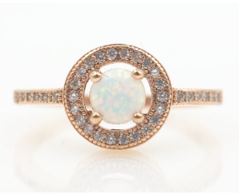 Rose gold on silver opal halo dress ring stamped 925   Condition Report   Click here for further images, condition, auction t