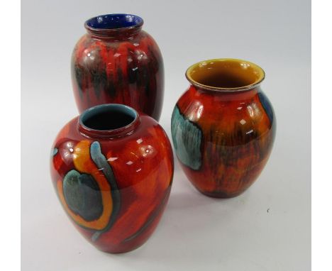 Three Poole Pottery ovoid vases, 21cm, 15cm and 16cm.